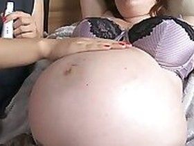 Cristin gives pregnant pussy a massage